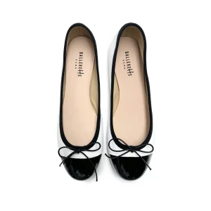 Ballerine bianche in pelle con punta in vernice nera